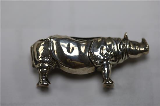 An Edwardian novelty silver pin cushion, modelled as a rhinoceros, Levi & Salaman, Birmingham, 1908, 46mm & two others.